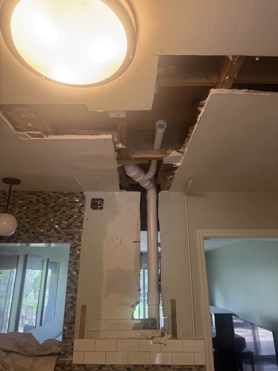 Ceiling drywall repair around a light fixture