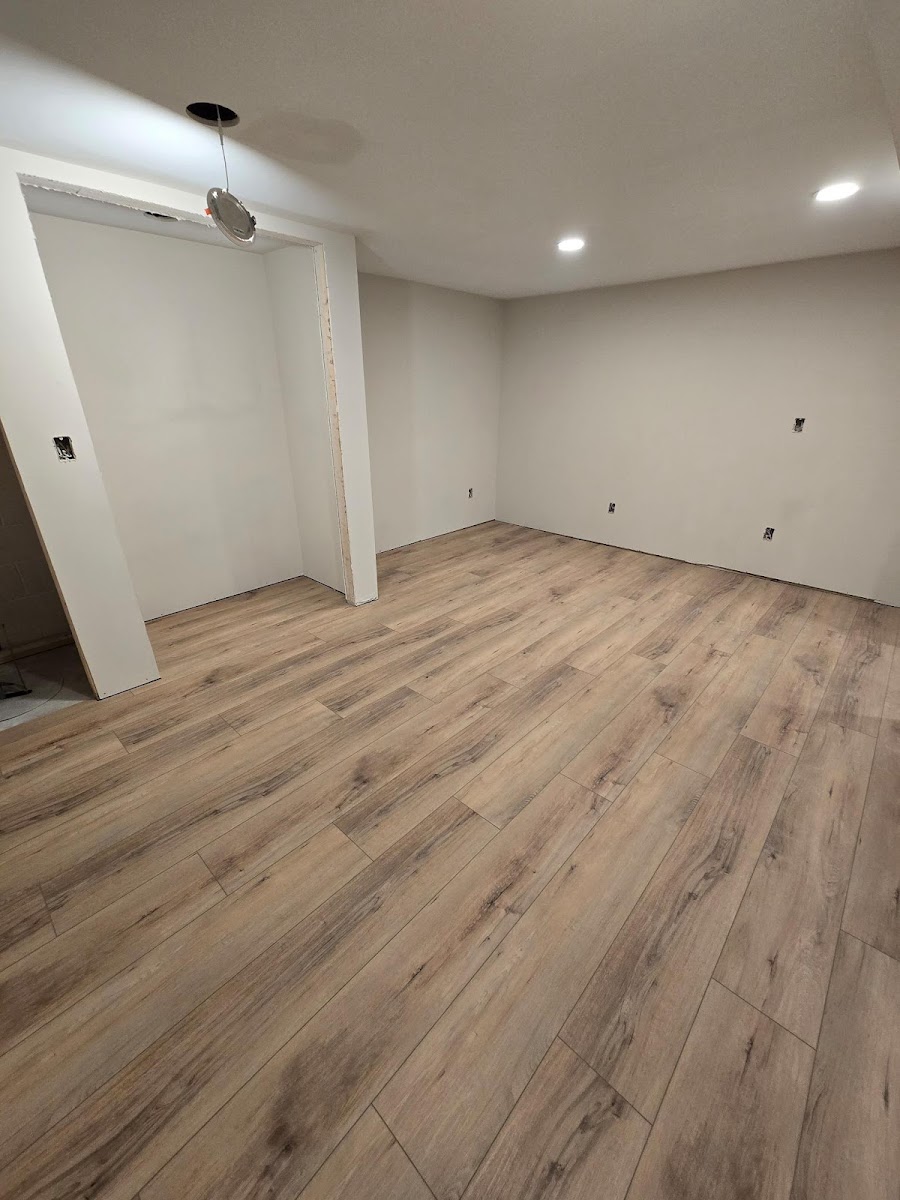 Finished room with smooth walls and new flooring