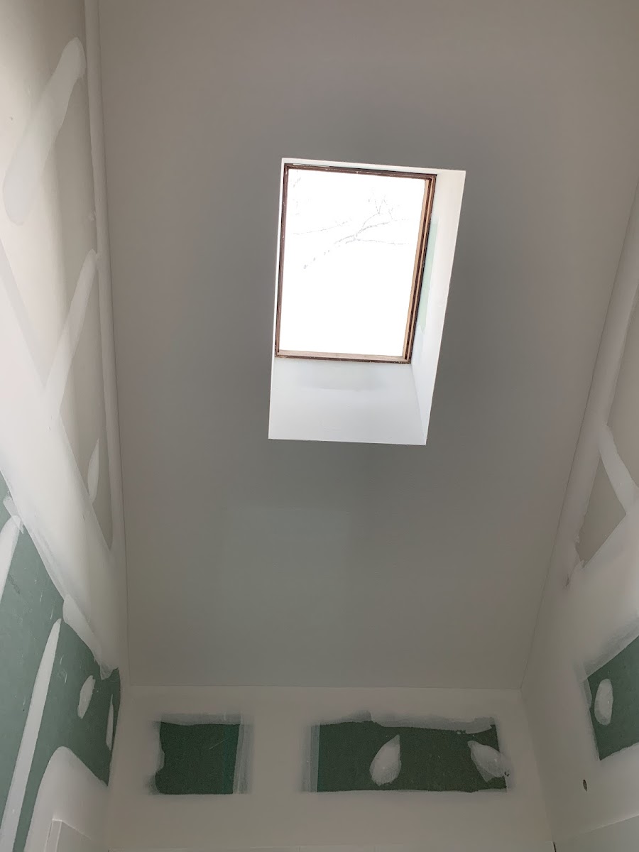 Vaulted ceiling drywall around a skylight